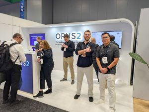 Opus 2 team at Legalweek 2026 booth, sharing AI expertise